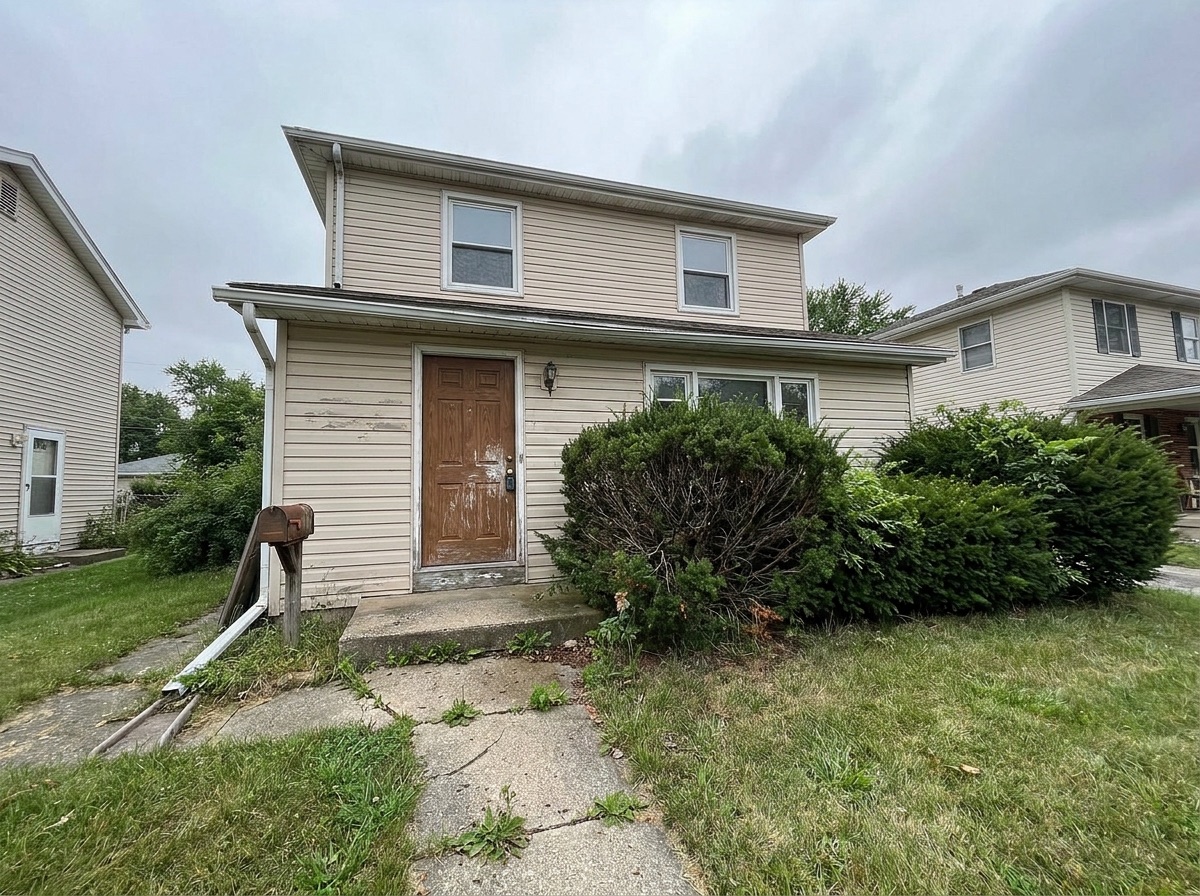 Tired, faded home exterior before refresh